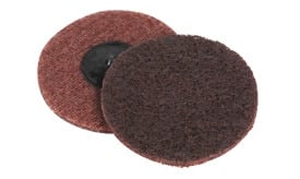 Brown abrasive cleaning pads with a black backing for scrubbing and polishing surfaces, ideal for various cleaning tasks.