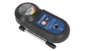 Brake fluid tester VSD-21 with test button and indicator lights for measuring fluid quality and moisture content.