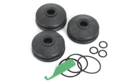 Set of three rubber suspension bushings with green installation tool and black O-rings for automotive applications.