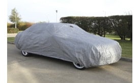 Grey car cover providing protection for a vehicle, designed to shield from dust and weather elements, suitable for outdoor use.