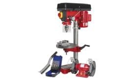 Red bench drill with adjustable table, drill bits, and grinding wheels, ideal for precision drilling tasks.