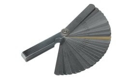 Precision feeler gauge set featuring multiple metal blades for measuring gaps and clearances in engineering and automotive applications.