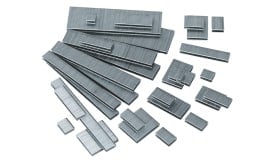 A collection of assorted metal staples in various sizes and shapes for office and craft use, ideal for stapling documents.