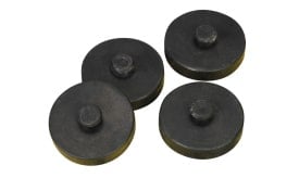 Set of four black weights with a circular design, ideal for fitness and strength training exercises.