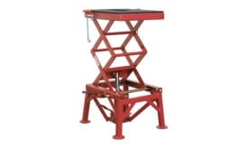 Red hydraulic scissor lift table designed for lifting heavy loads with adjustable height and sturdy construction.