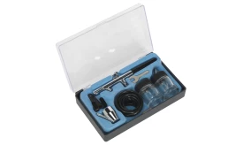 Comprehensive airbrush kit featuring airbrush, jars, hose, and cleaning tools in a protective case.